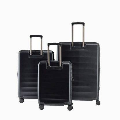 Set of three black hard shell suitcases with telescopic handles on white background9