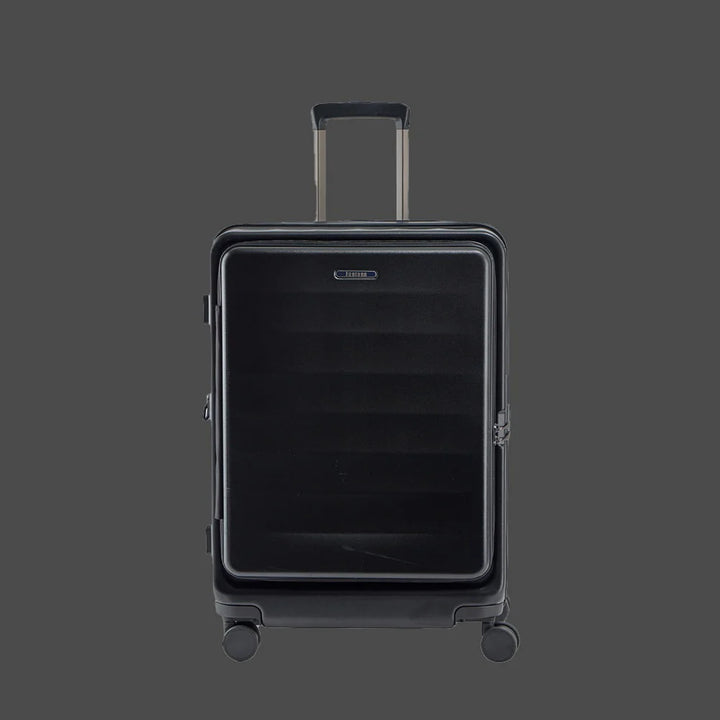 Black hard shell rolling suitcase with telescopic handle on gray background